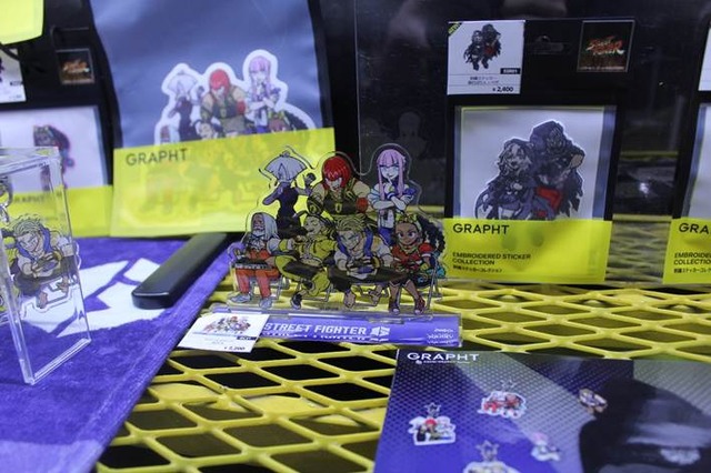 『スト6』モニターマスコットが可愛すぎる…！コラボグッズやアパレルなどがクールなGRAPHT物販ブースレポ【TGS2025】