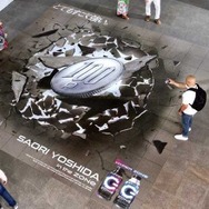 霊長類最強・吉田沙保里が投げた100円玉がブラジルに貫通！？エナジードリンク「ZONe」のユニークなプロモーションが話題