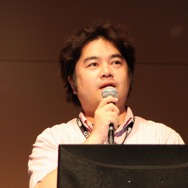 穀田氏